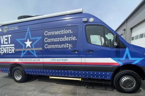 Blue van with "VET CENTER" and "Connection, Camaraderie, Community" written on it.