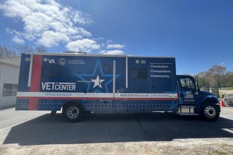 Blue Vet Center mobile unit parked on a sunny day.