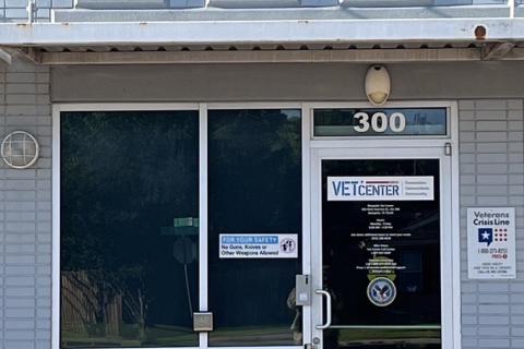 Vet Center sign above entrance to building with glass doors and windows.