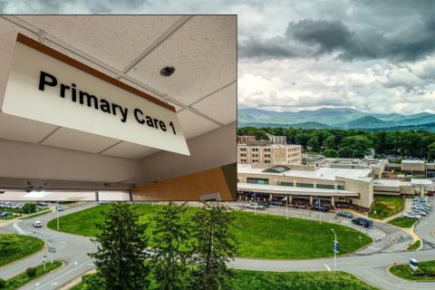 Primary Care sign and aerial view of hospital with mountains in background.