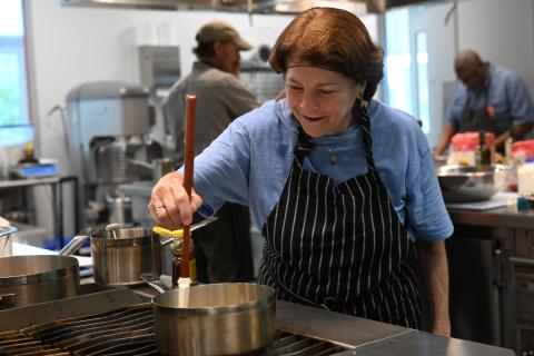 women veteran making stiring in a kitchen