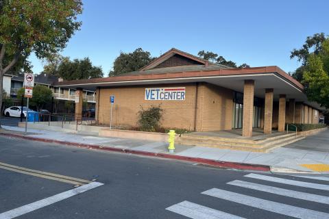 Street view of Vet Center with sign, sidewalk, and crosswalk.