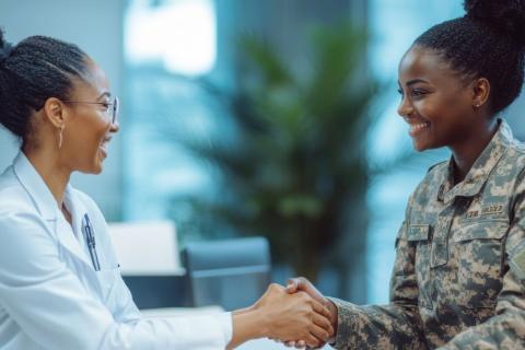 Doctor in white coat shaking hands with female soldier.