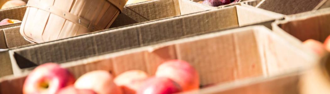 Boxes of apples and peaches