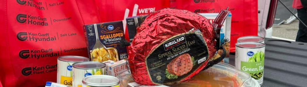 ham, pumpkin pie, canned cranberries and green beans with red bags with ken garff logo in background