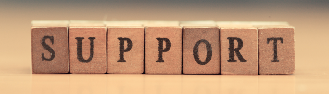 Wooden blocks with letters spelling out the word support.