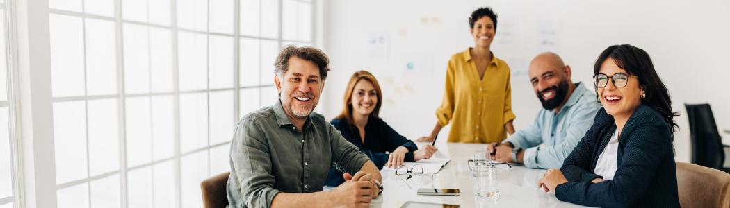 men and women in a meeting space