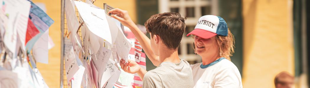 children placing drawings