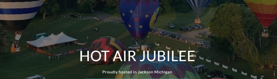 Jackson Hot Air Jubilee with several hot air balloons in the background at Ella Park