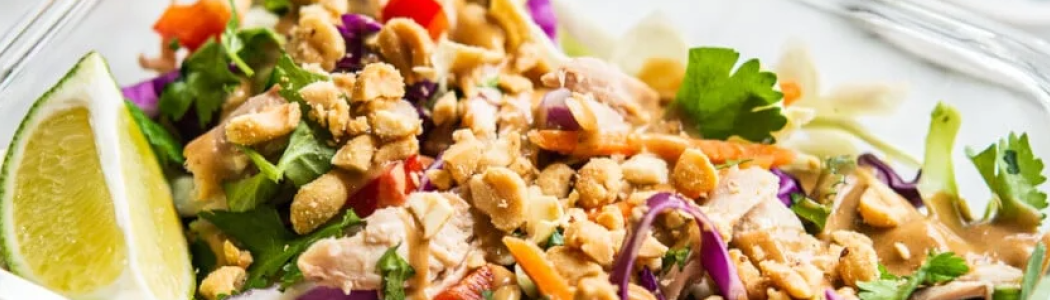 Thai chicken salad in glass container