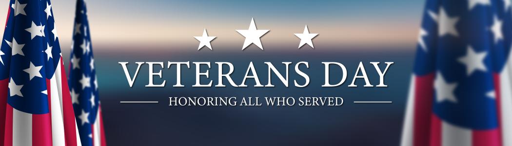 flags surrounding the words Veterans Day - honor those who served