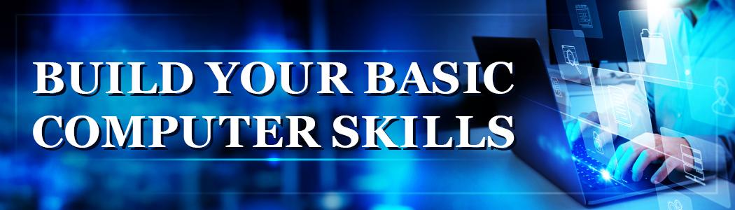 Text "Build your basic computer skills" over blue background with blurred hands using a computer.