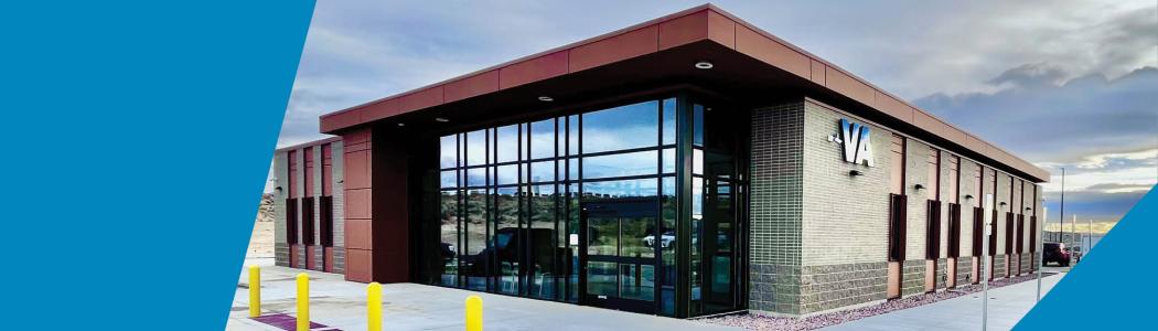 Modern VA Clinic with glass windows and red roof.