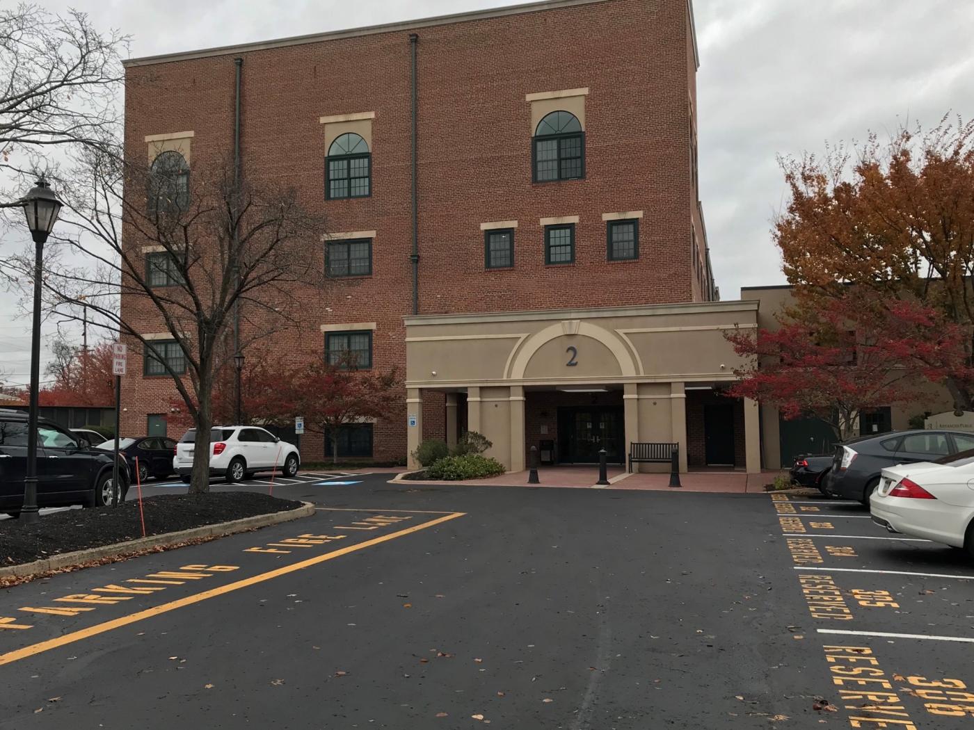Building entrance from rear parking lot