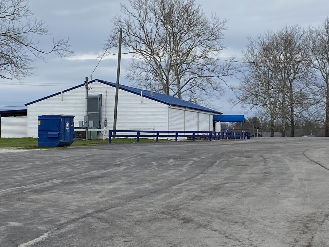 Photo of white building with blue roof