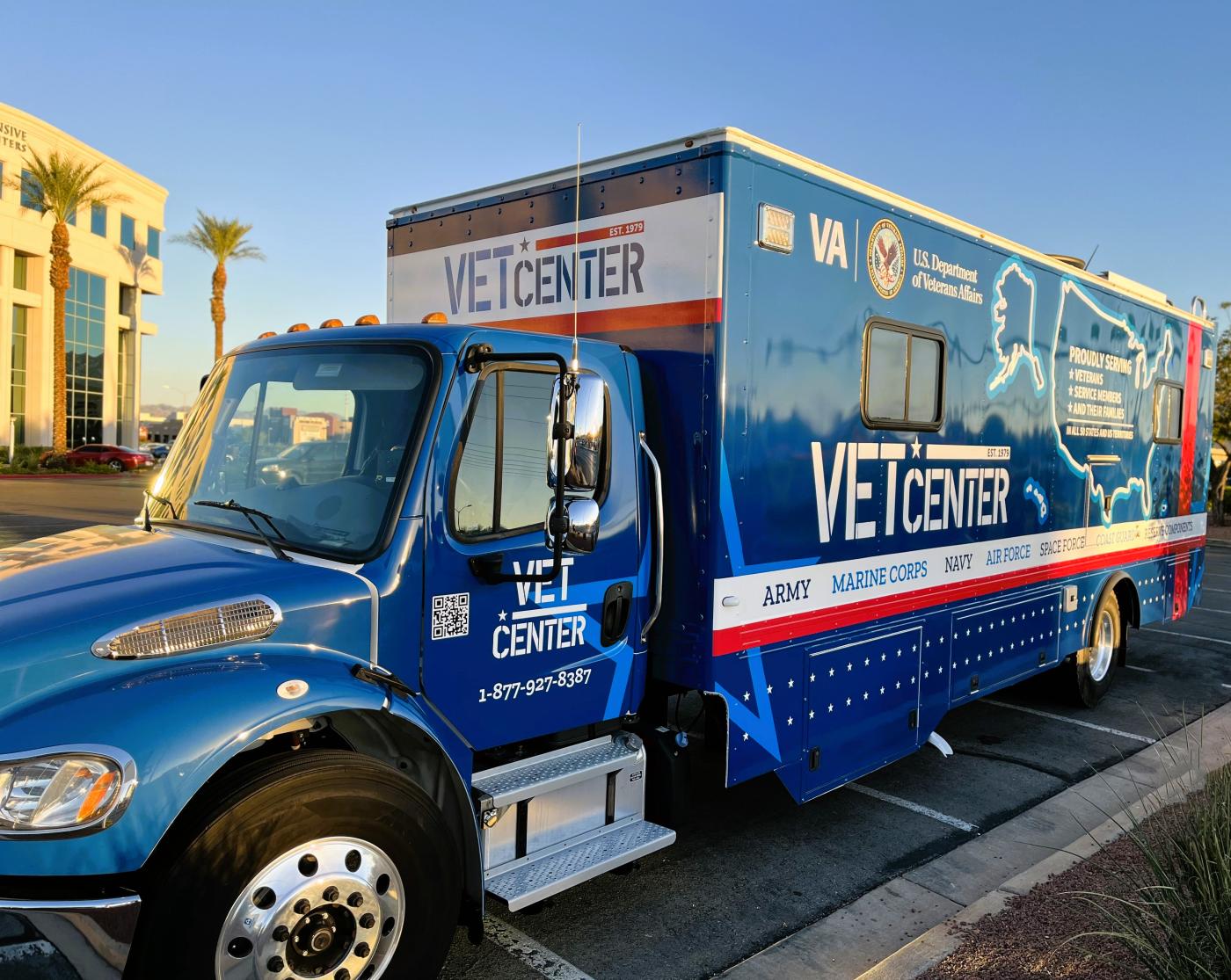 Mobile Vet Center (in blue vehicle wrap). This vehicle is a mobile service resource that provides services in various areas in the capacity of outreach support, resource connection and referral services for all elements of the Armed Forces, Veterans, and Families that desire assistance.