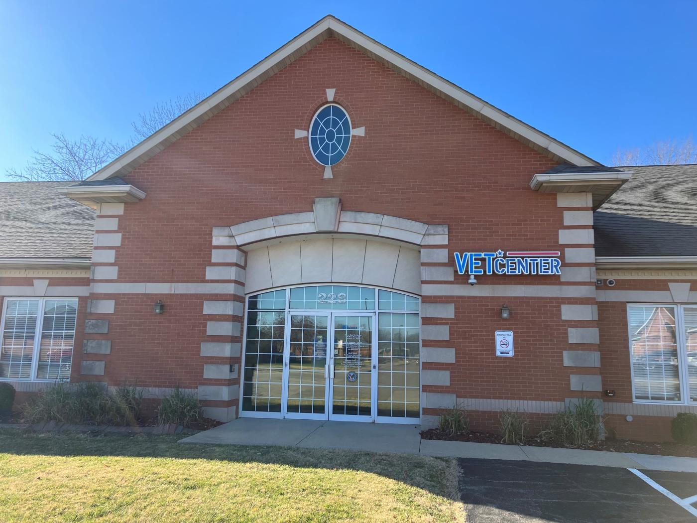 Building with brick and stone façade. Vet Center sign