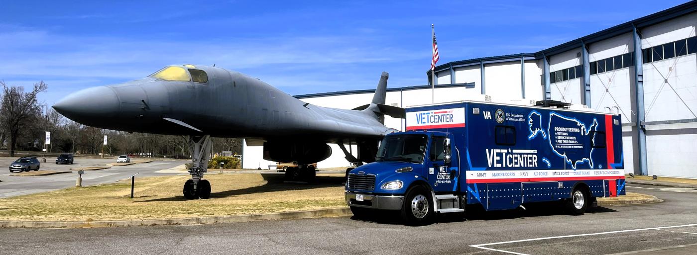 A Mobile Vet Center Truck parked in front of a B-1 Lancer heavy bomber jet, on display at the Museum of Aviation, Warner Robins GA.