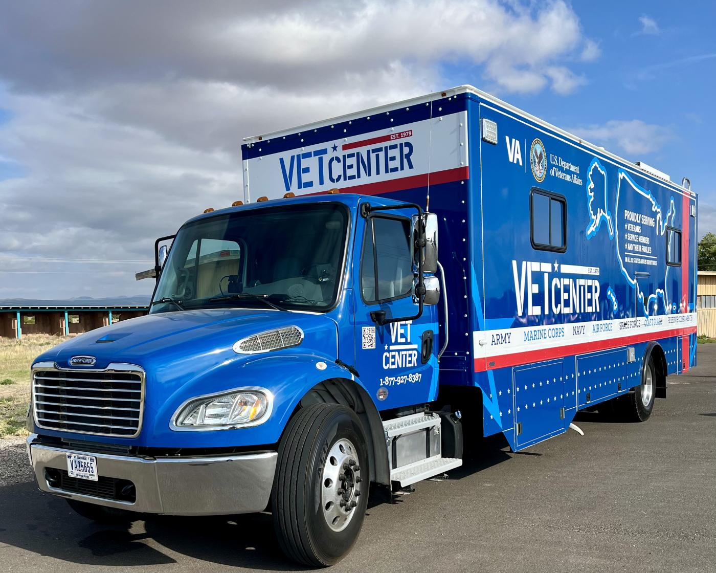 Mobile Vet Center shown from driver's side front and extends to the side to show the Vet Center logos
