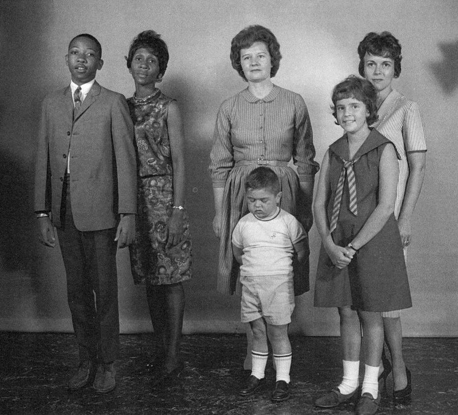 Three kidney transplant recipients standing alongside their maternal donors.