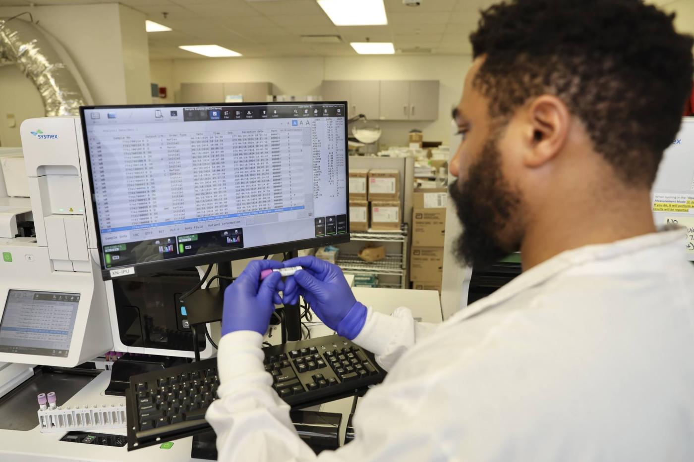 Medical laboratory scientist in Hematology at VA Connecticut Healthcare System reviewing sample results, June 2024.