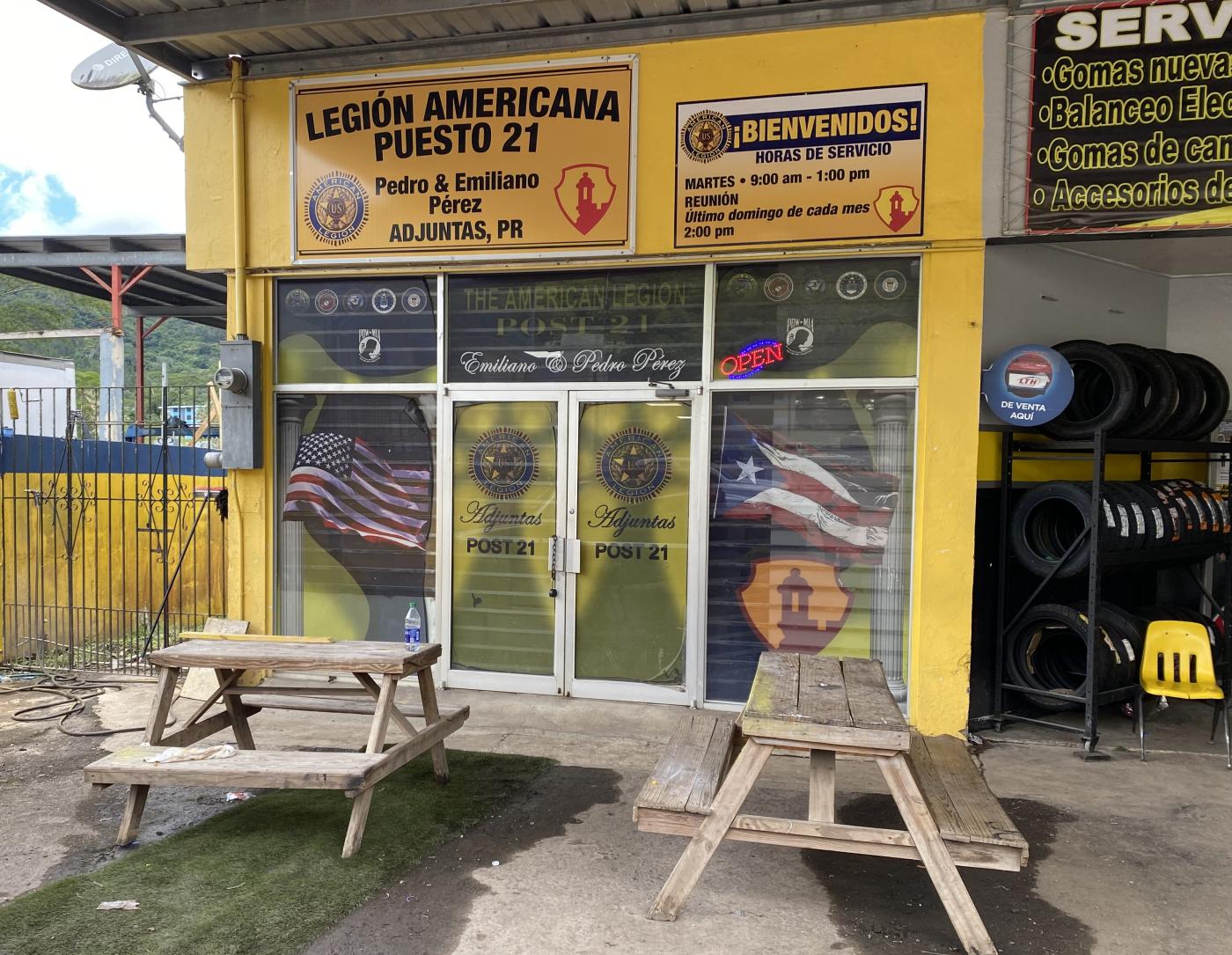 Yellow building with double door entrance on left hand side. American Legion signage posted over double door entrance.