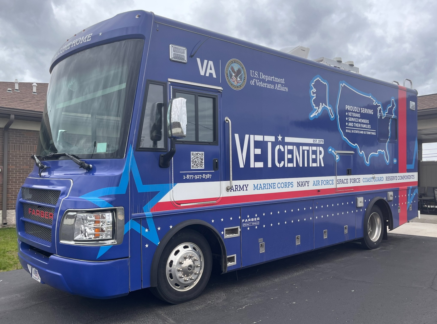 large blue vehicle wrapped with Vet Center branding