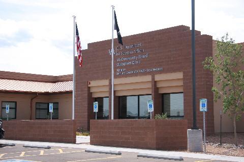 Brown Brick Government Building. Main entrance adjacent to front parking lot.