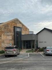 Entrance to Patriots Hall in Dripping Springs is through the double doors to left side of the gray building.
