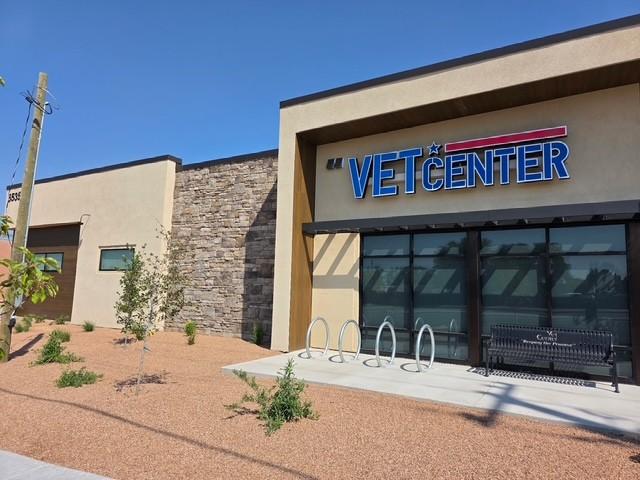 The Santa Fe Vet Center building has a tan stucco exterior with brick and wood trim.