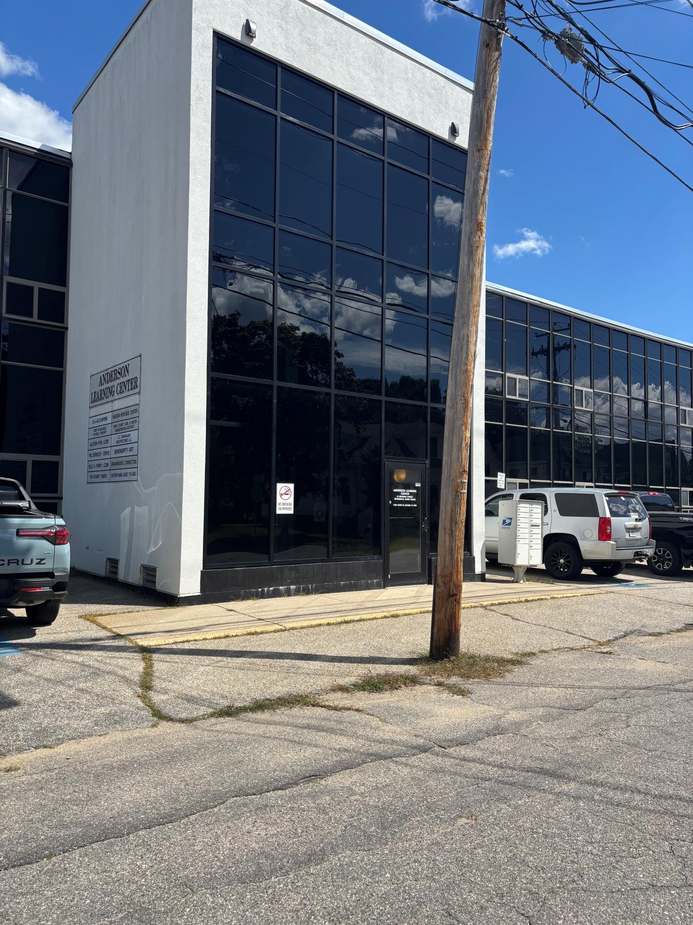 A white building with black windows.