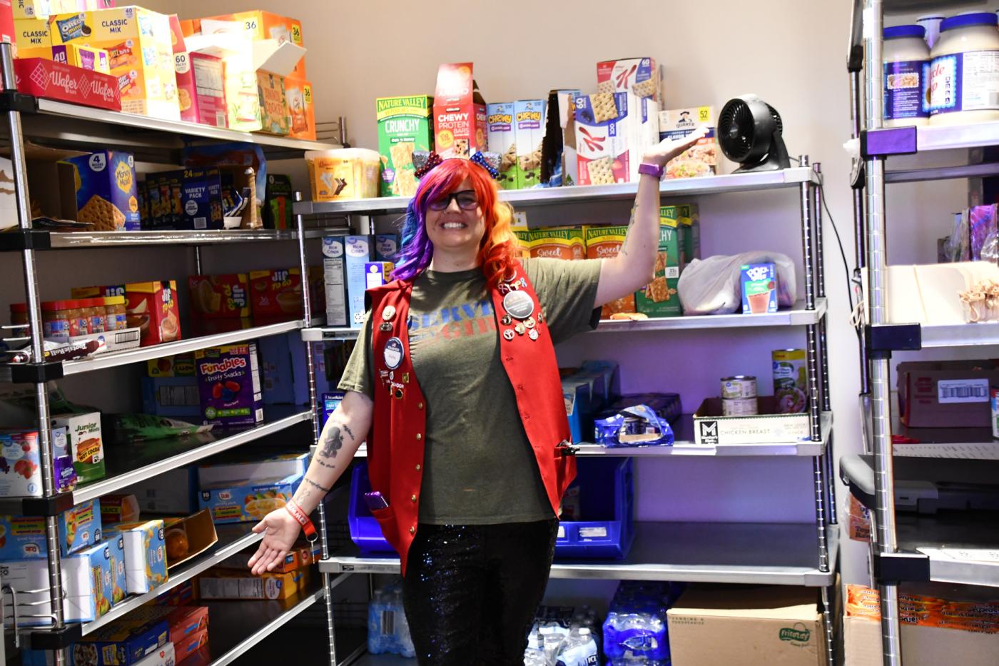 A volunteer poses in the Omaha VA Veterans Food Pantry.