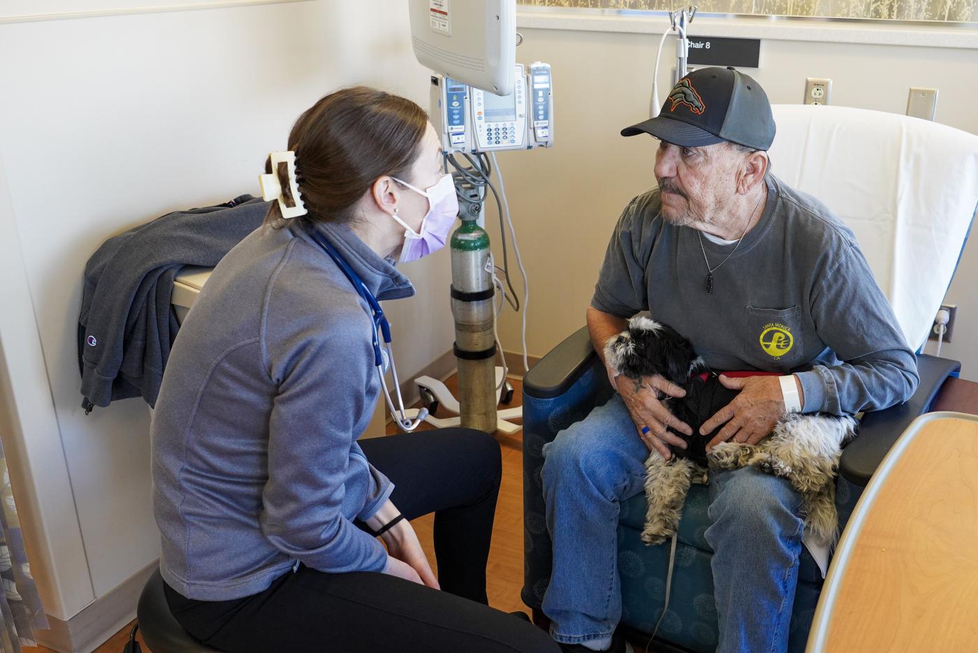 Navy Veteran Rick Smith gets care in an exam room.