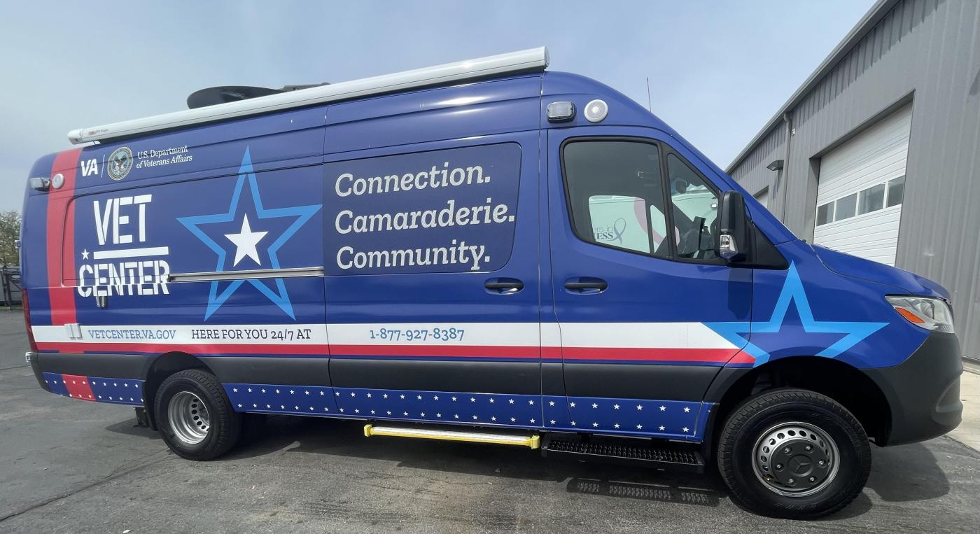Blue van with "VET CENTER" and "Connection, Camaraderie, Community" written on it.