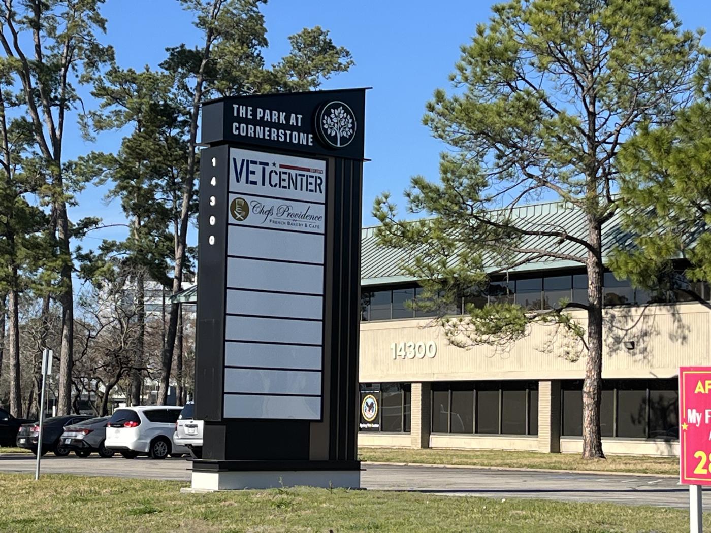 Vet Center sign in front of building with the green roof.