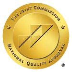 Gold seal with The Joint Commission National Quality Approval logo.