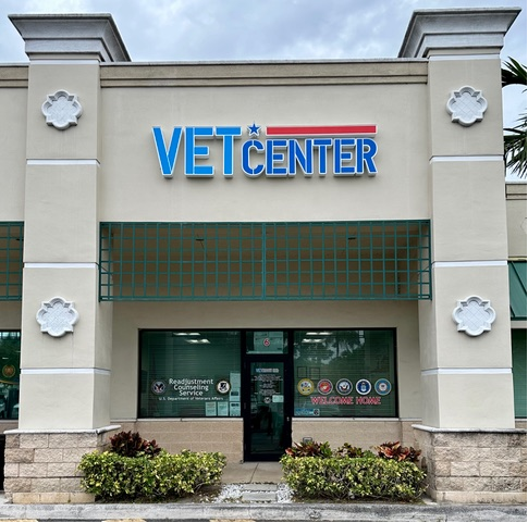 Vet Center storefront with green plants in front.