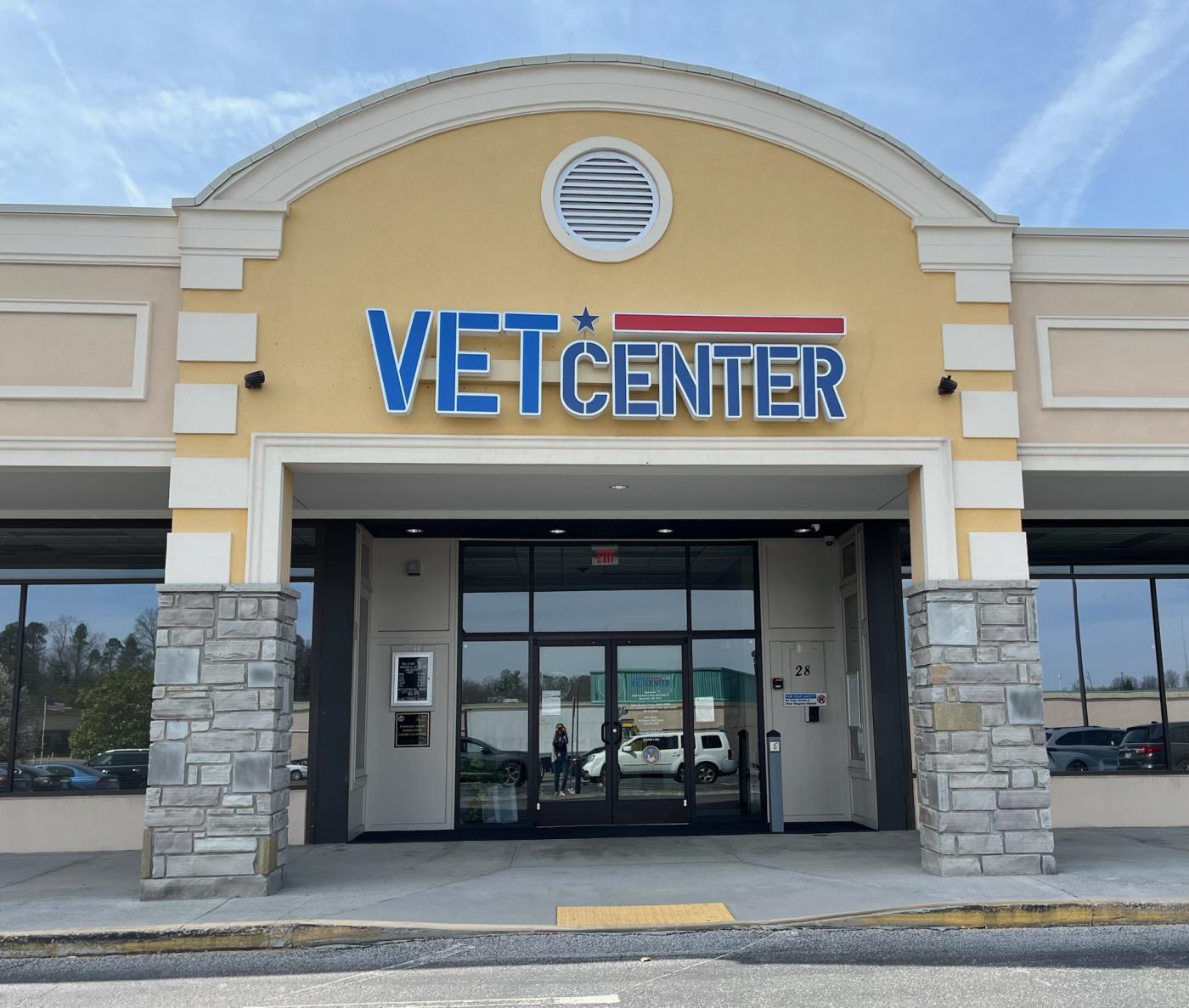 Vet Center entrance with glass doors and blue logo.