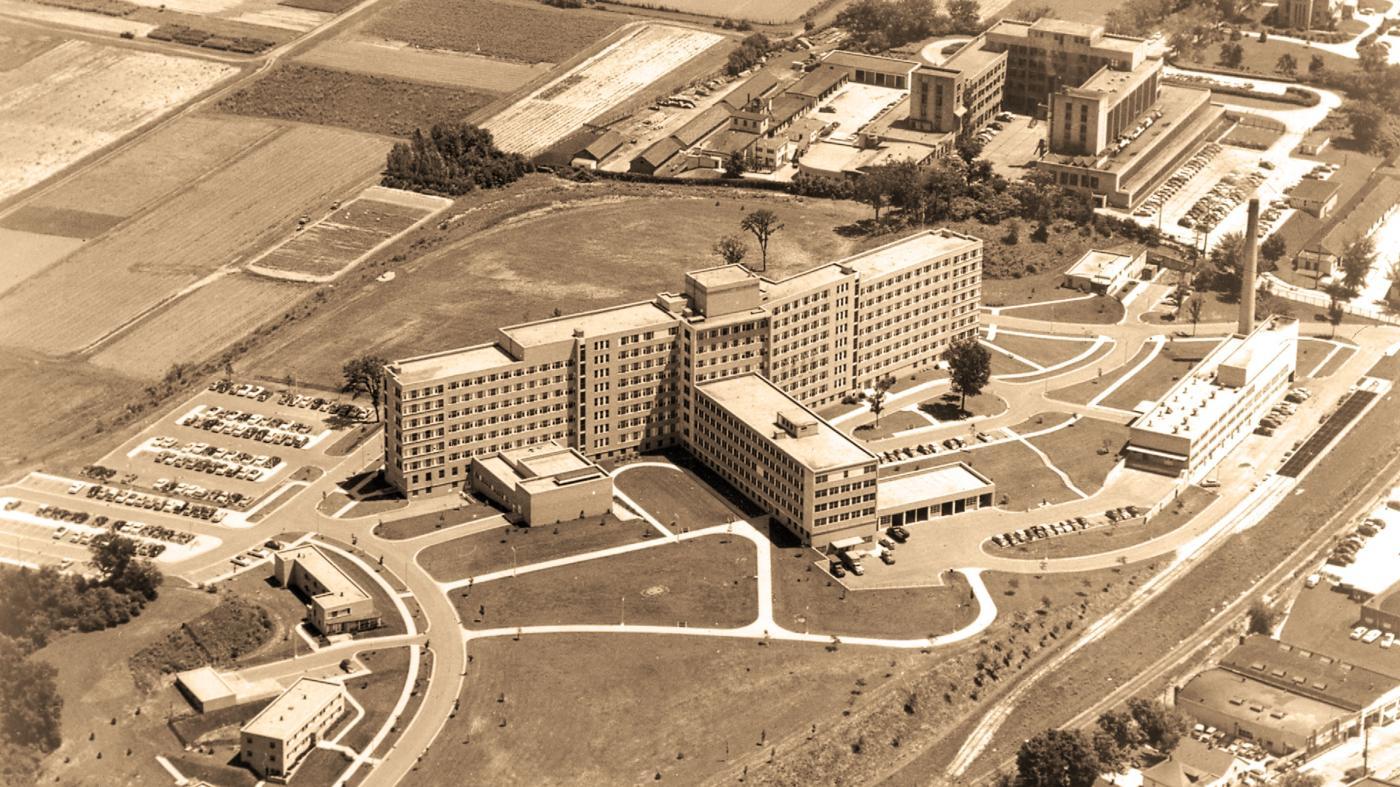 Vintage aerial photo of large hospital complex with multiple buildings and pathways.