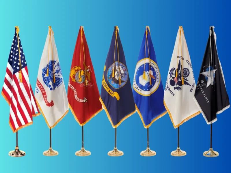 Seven U.S. military flags lined up on blue background.